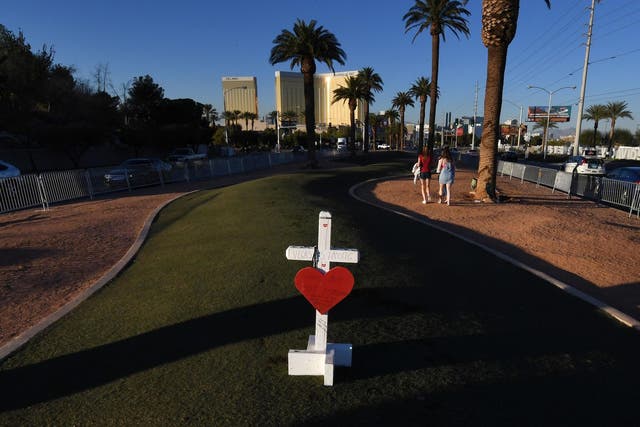 A solitary cross at a memorial site in front of the Mandalay Bay Hotel for the victims of the worst shooting in US history