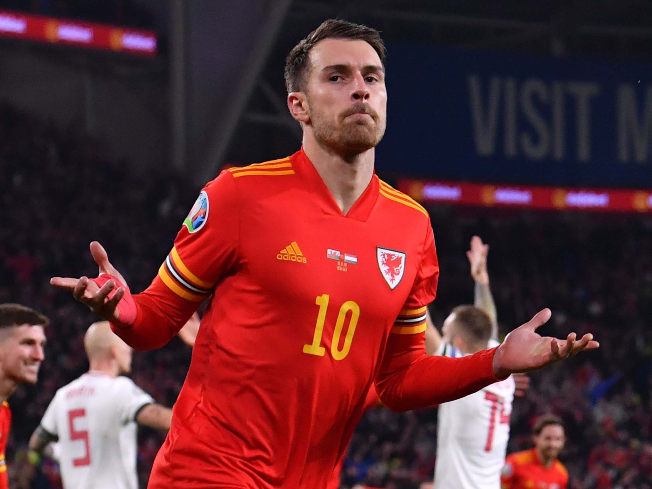 Aaron Ramsey celebrates scoring for Wales