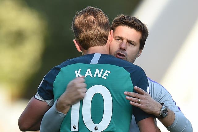 Tottenham Hotspur's Mauricio Pochettino embraces Harry Kane