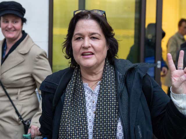 Amy Beth Dalla Mura gestures as she leaves Westminster Magistrates' Court, London, on 20 November