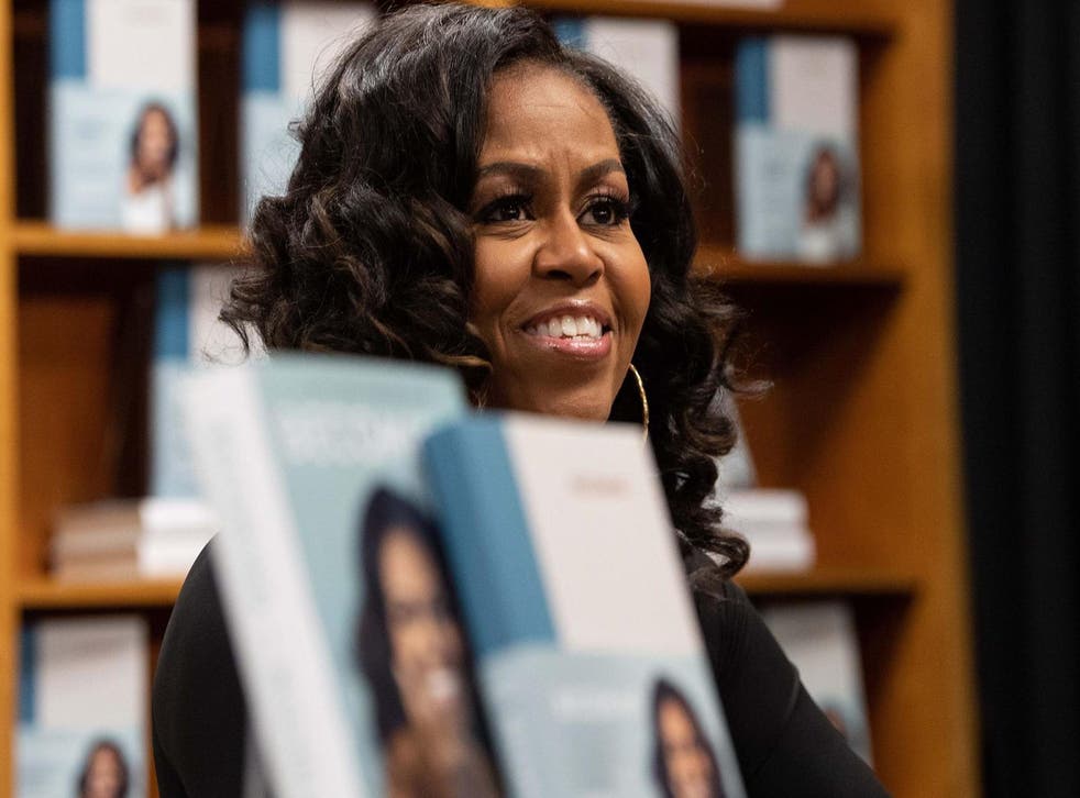 Michelle Obama meets with fans during a book signing on the first anniversary of the launch of her memoir Becoming at the Politics and Prose bookstore in Washington, DC, on 18 November, 2019.