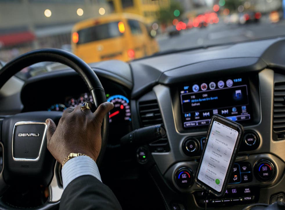 After dropping off passengers at a Broadway play, Johan Nijman, a for-hire driver who runs his own service and also drives for Uber on the side, drives through the West Side of Manhattan on Wednesday evening, August 8, 2018 in New York City