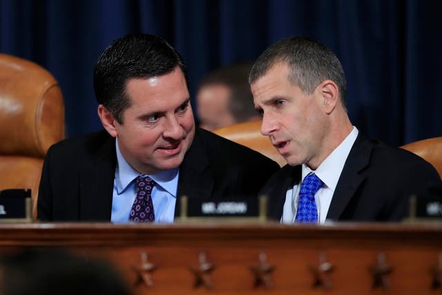 Devin Nunes, Republican ranking member of the House Intelligence Committee, left, confers with Republican staff attorney Steve Castor during the impeachment hearing evidence of Fiona Hill and David Holmes
