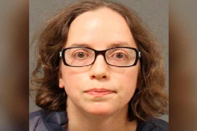 Mugshot of Meredith Lowell who is accused of stabbing a woman wearing fake fur