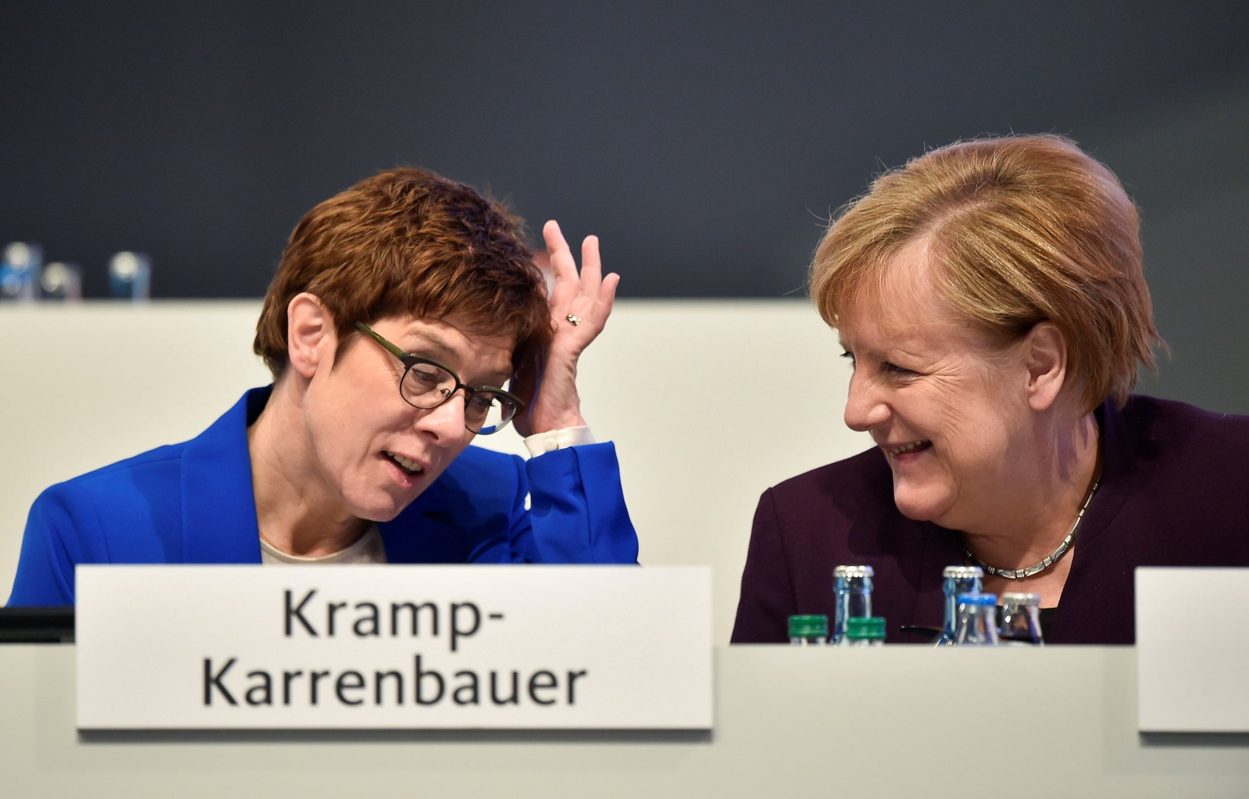 Angela Merkel talks to party chairwoman Annegret Kramp-Karrenbauer during the Christian Democratic Union (CDU) party congress in Leipzig