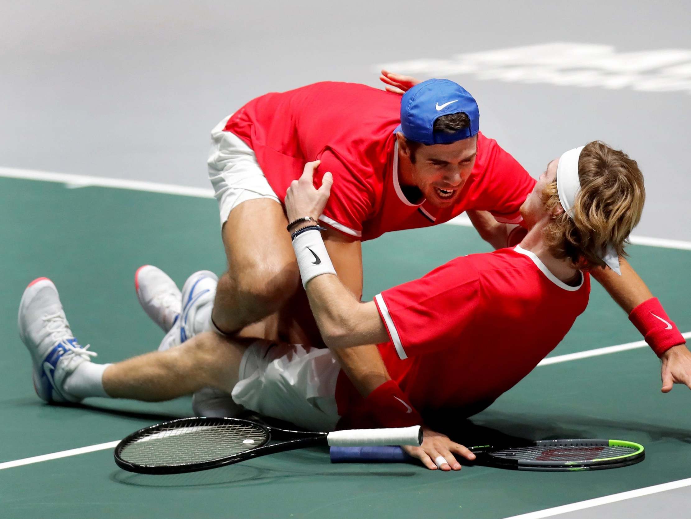 Karen Khachanov (L) and Andrei Rublev (R) celebrates victory in the doubles