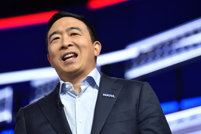 Democratic presidential candidate former technology executive Andrew Yang walks onto the stage before a Democratic presidential primary debate in Atlanta.