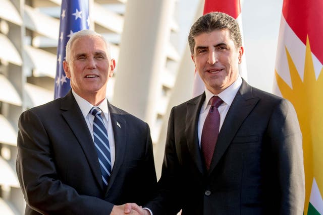 Mike Pence is greeted by the president of the Kurdistan region of Iraq, Nechirvan Barzani, at Erbil airport