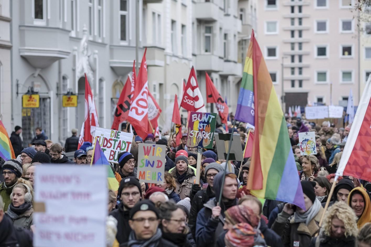 People take part in a counter-protest against the German far-right party NPD in Hanover