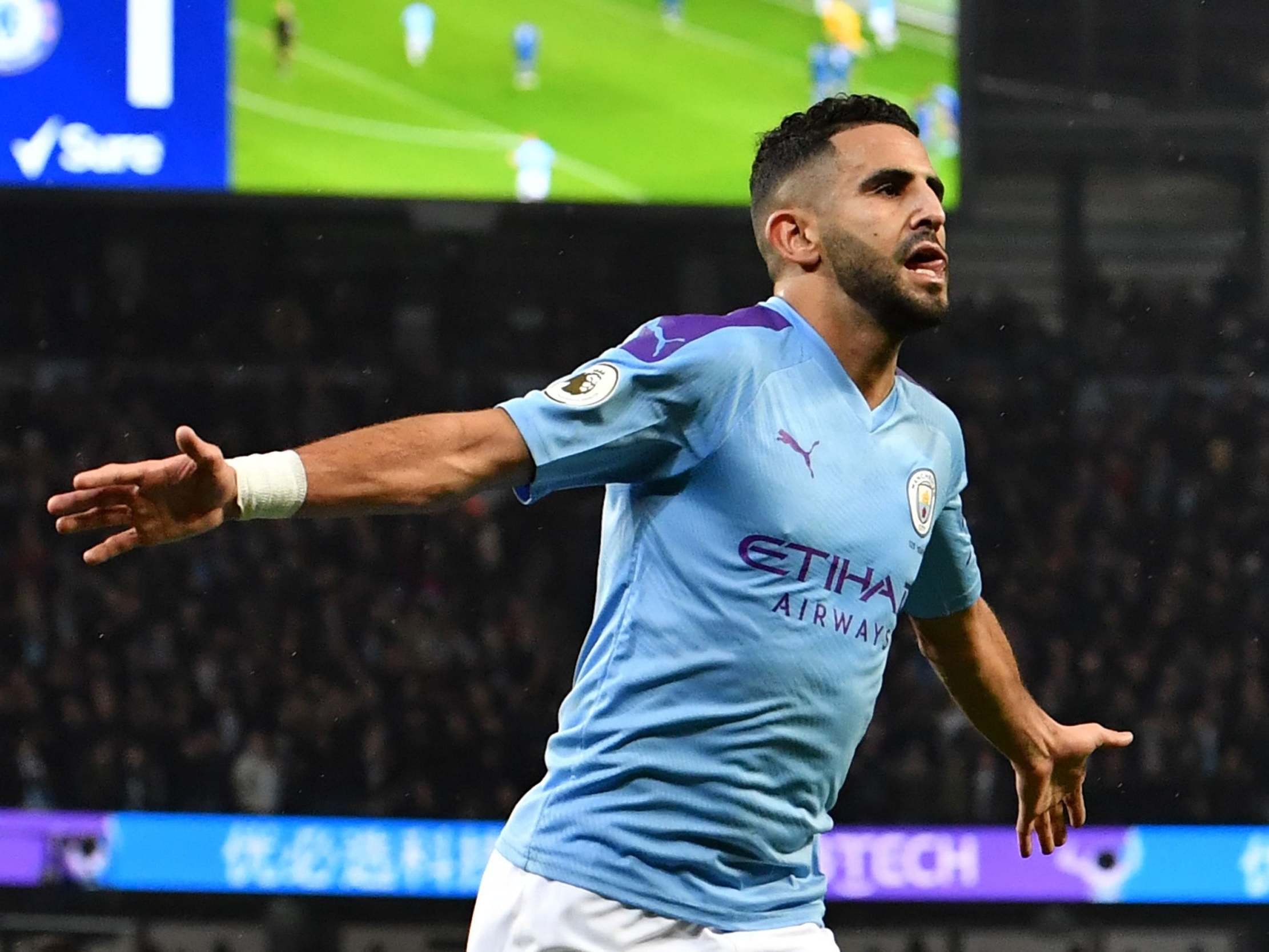 Riyad Mahrez celebrates scoring City's second goal