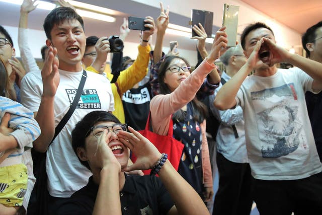 Voters celebrate after hated pro-Beijing politician Junius Ho loses in the Hong Kong district council election