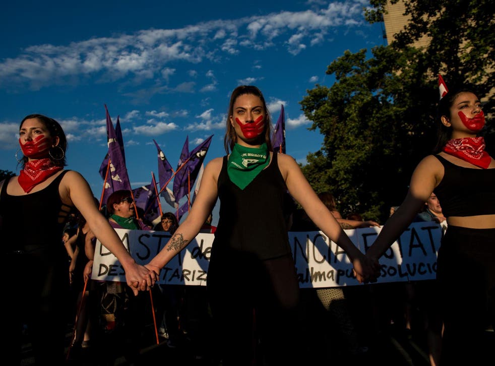 Activists take part in a march on the eve of the commemoration of the International Day for the Elimination of Violence Against Women, in Santiago, on 22 November 2018.