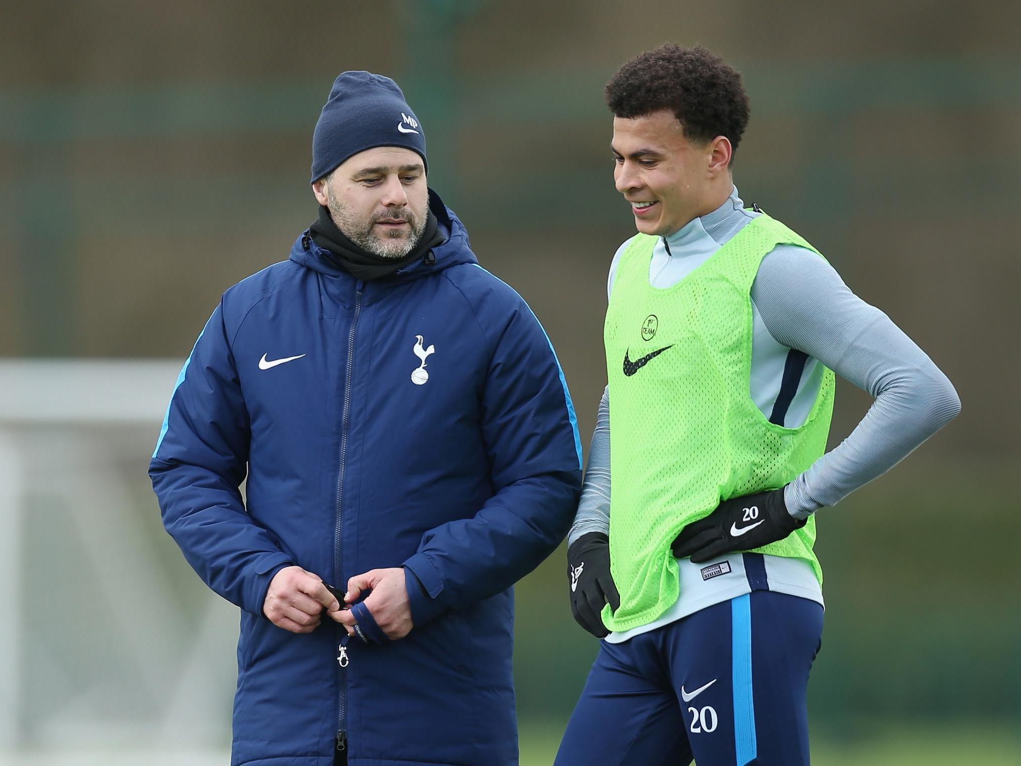 Tottenham Hotspur manager Mauricio Pochettino talks to Dele Alli