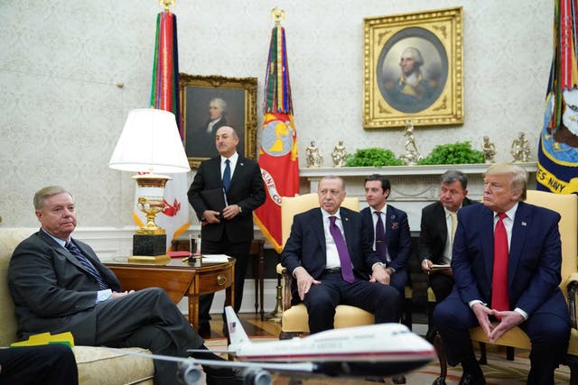South Carolina Republican senator Lindsey Graham, left, with Turkish president Recep Tayyip Erdogan, centre, and US president Donald Trump, right, in the Oval Office on 13 November, 2019