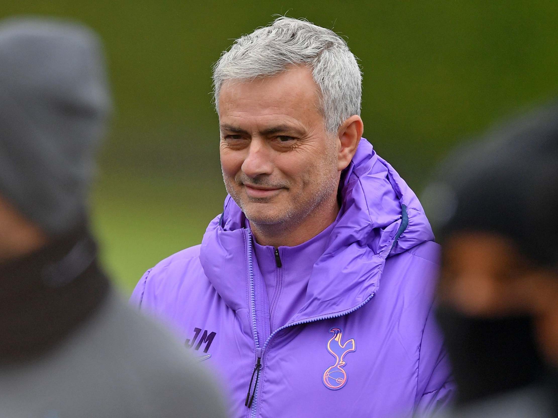 Tottenham Hotspur head coach Jose Mourinho smiles as he takes a team training session
