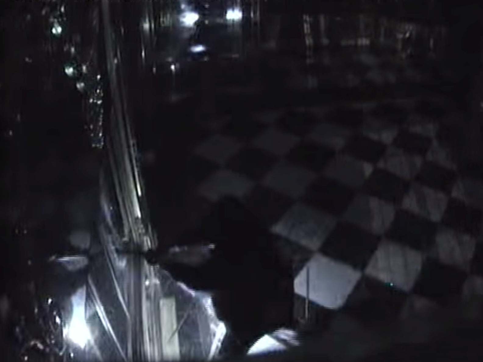 A thief smashes into one of the display cabinets in the Green Vault museum in Dresden