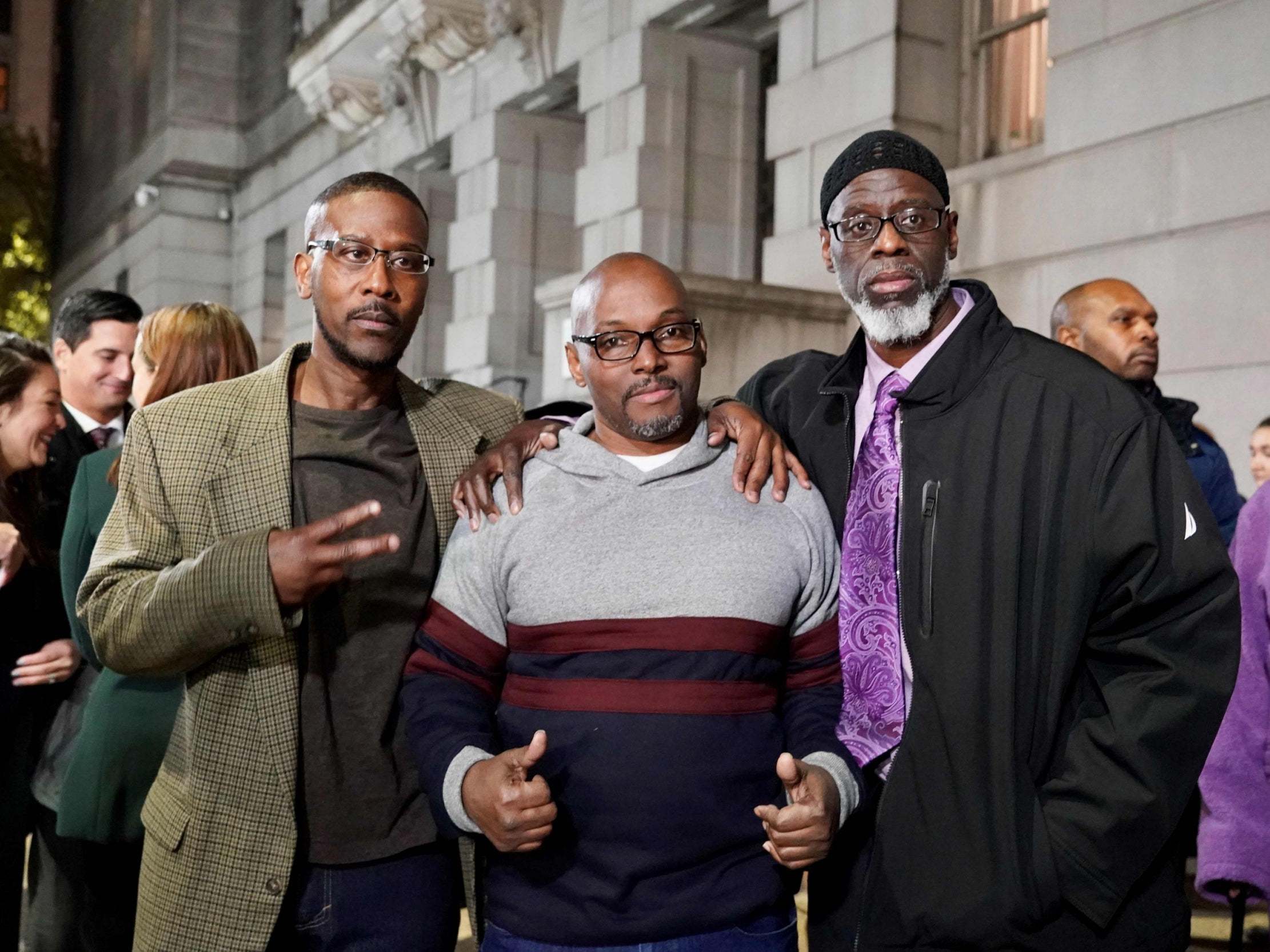 (L-R) Alfred Chesnut, Andrew Stewart and Ransom Watkins pose for a photo after being released from prison in Baltimore, Maryland, US, on 25 November 2019 after serving 36 years for a murder they did not commit.