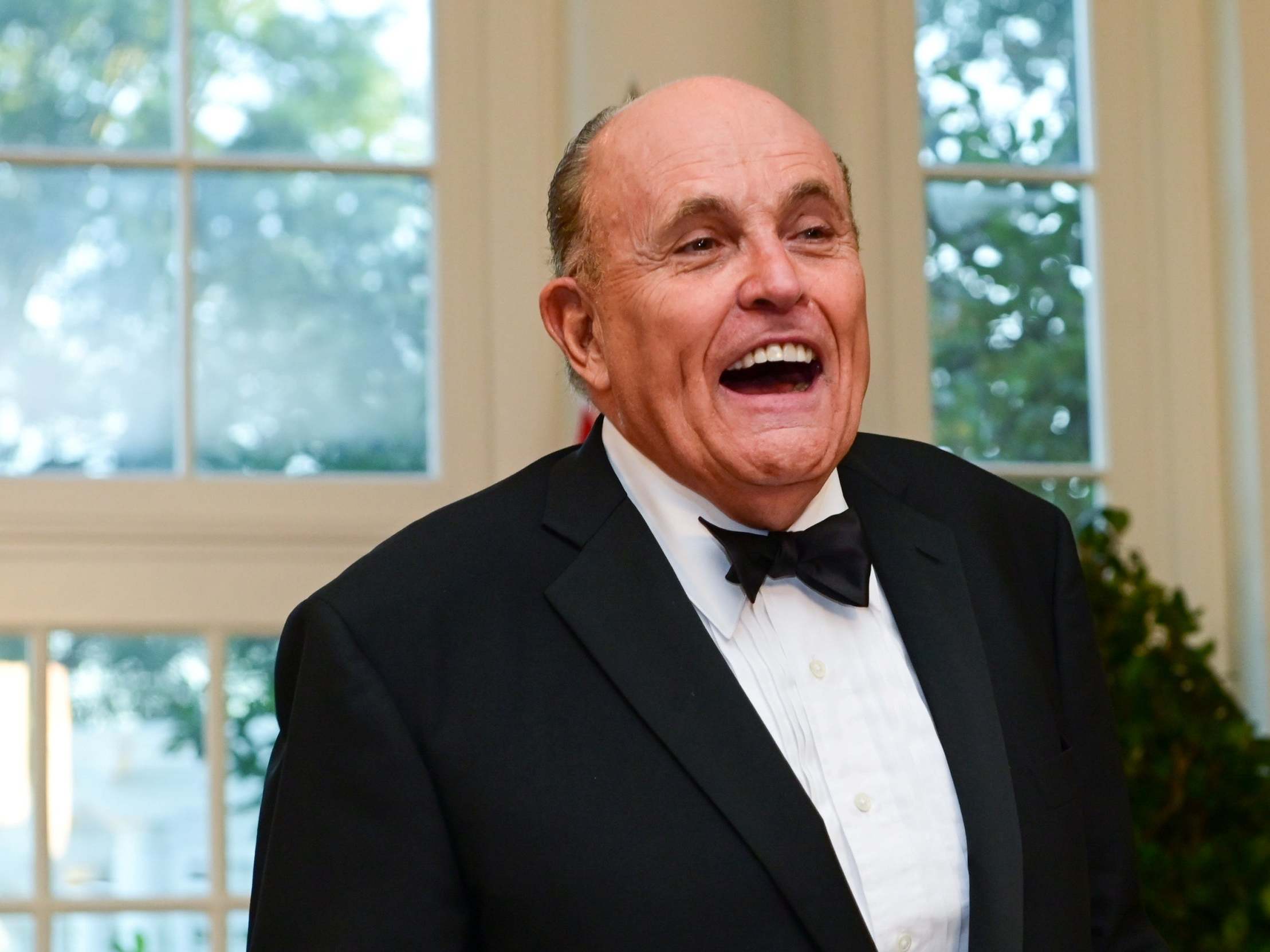 Mr Giuliani pictured at a State Dinner in the White House in September