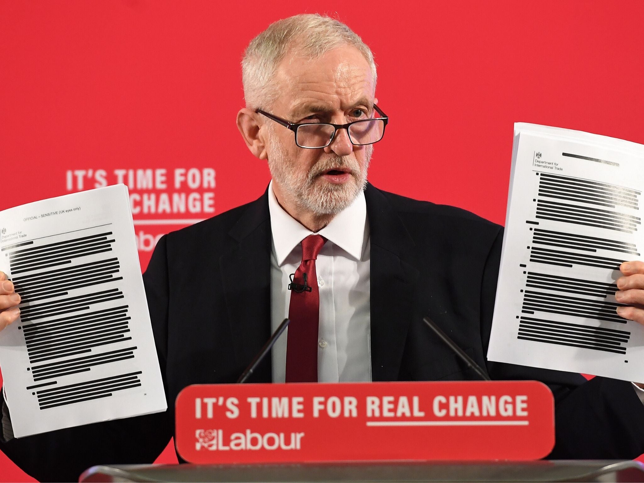 The Labour leader holds up part of the 451-page dossier