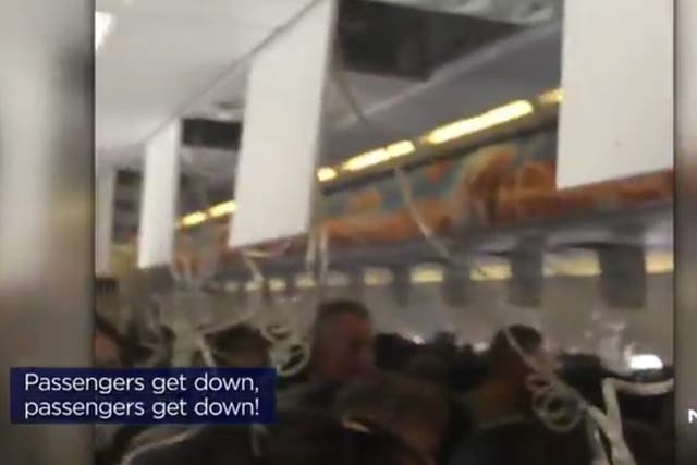Video from the incident shows cabin crew shouting 'passengers get down'