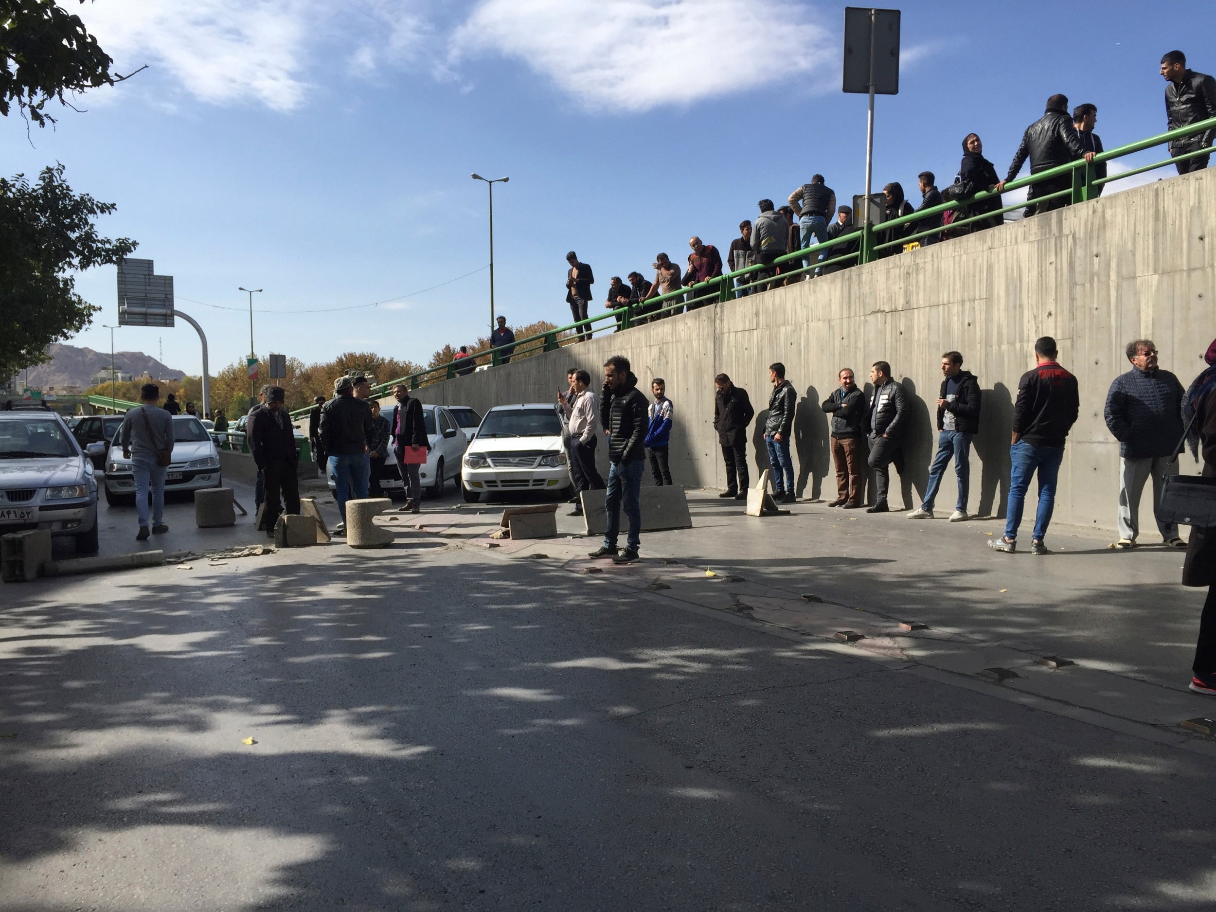 Demonstrators block a street during a protest in the central city of Isfahan, Iran on 16 November