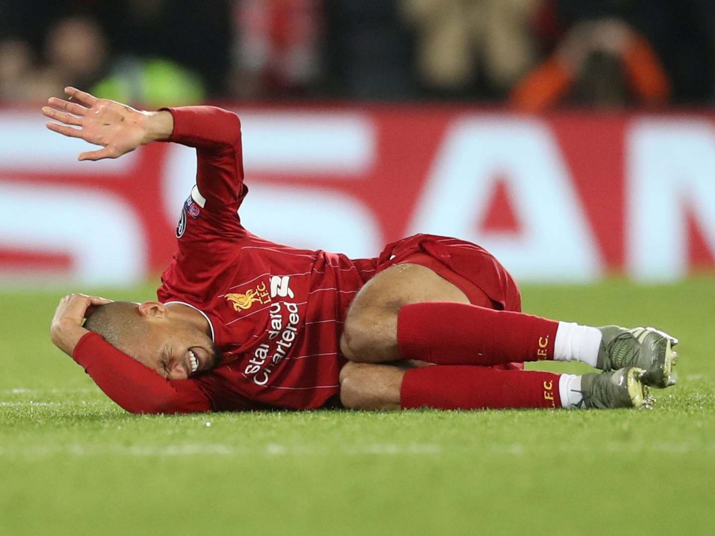 Fabinho grimaces after picking up ankle ligament damage