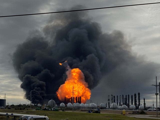 Flames are seen after a massive explosion that sparked a blaze at a Texas petrochemical plant