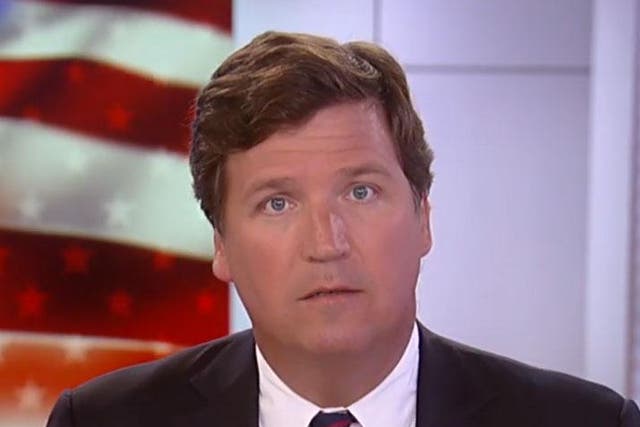 Tucker Carlson presenting his Fox News show in November 2019
