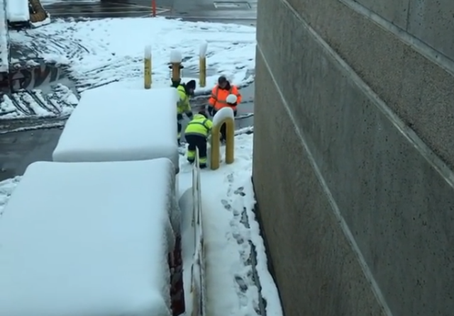 Staff at Denver airport build a snowman