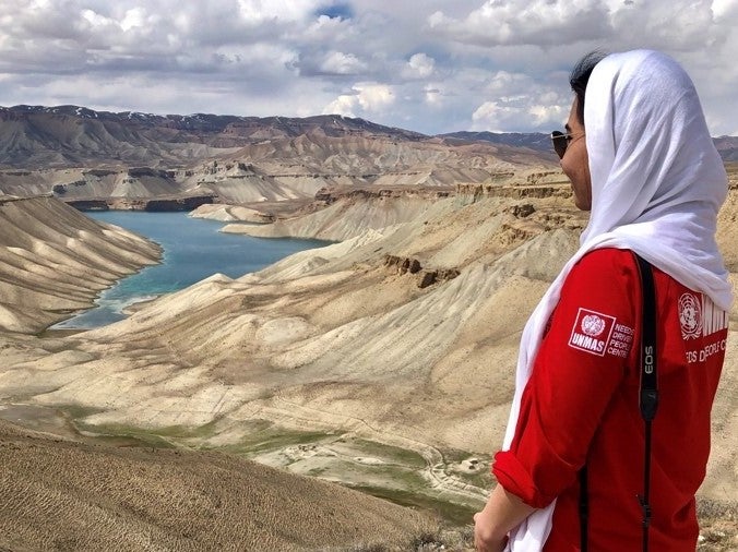 Makiz Nasirahmad, advocacy officer for UNMAS, in front of the Band-e Amir lake in Bamyan province