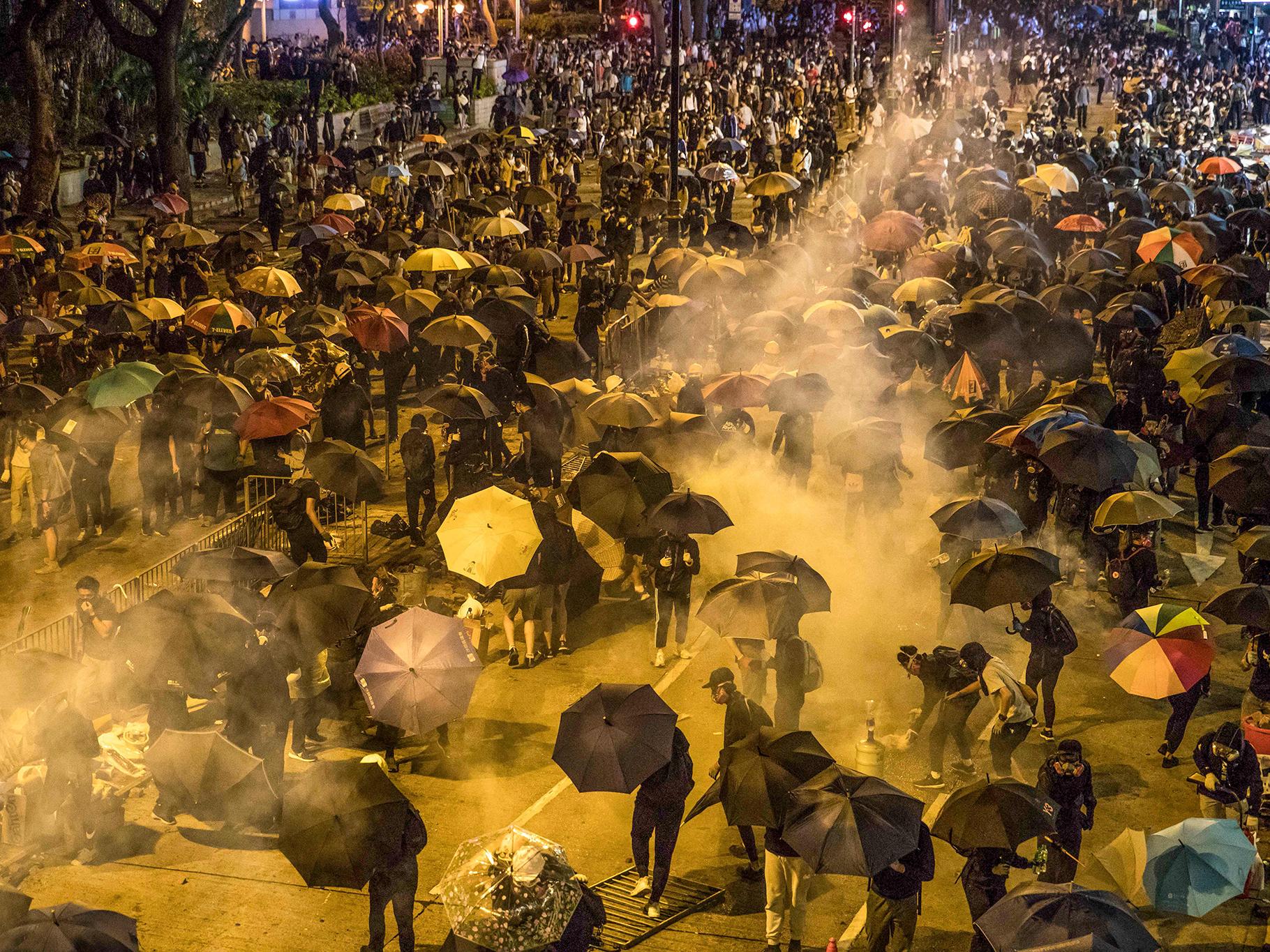 Hong Kong protesters clean mosque after police spray it with blue liquid