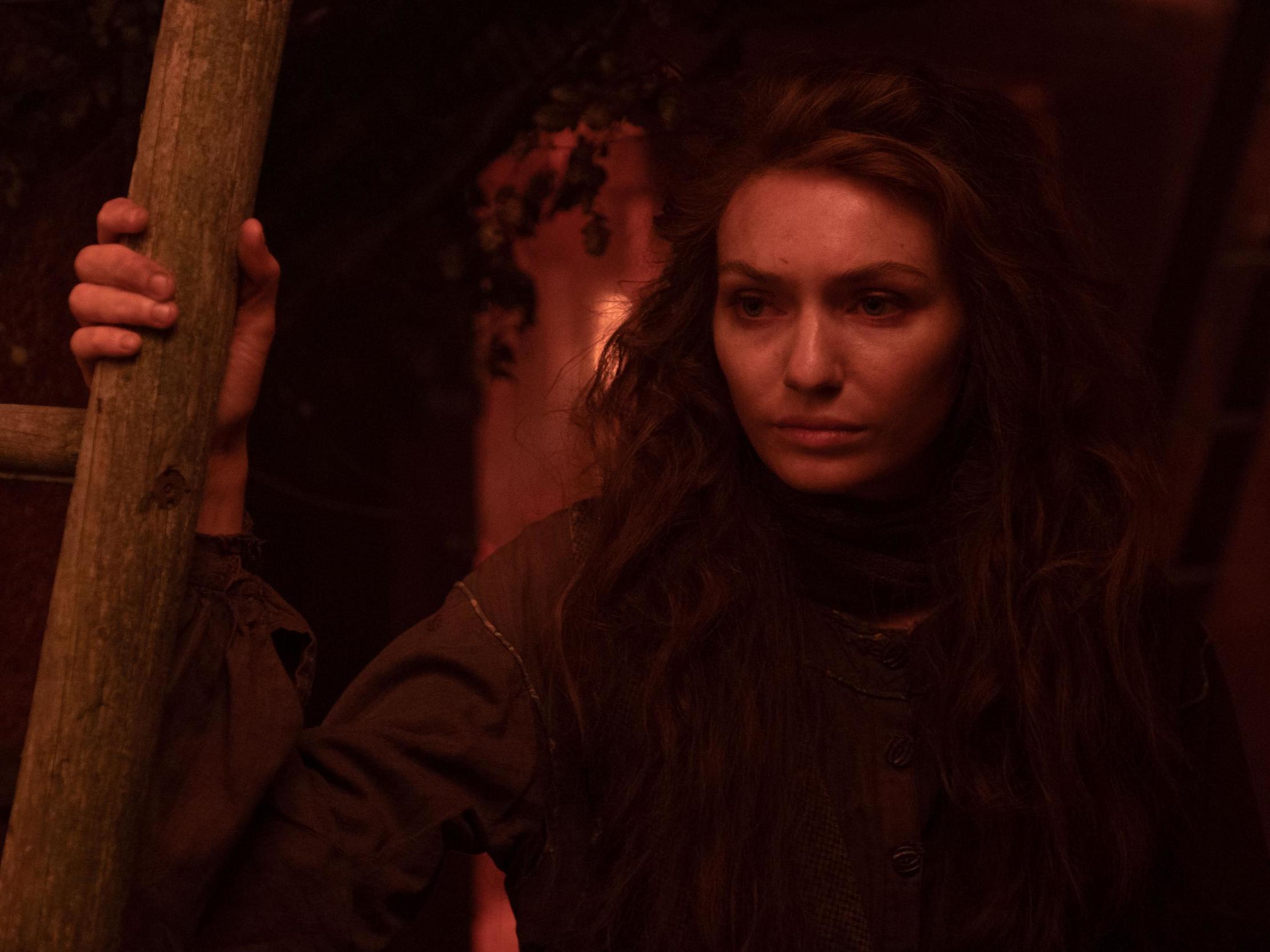 Amy (Eleanor Tomlinson) tries to find a safe place to escape from the 20-foot spiders from Mars