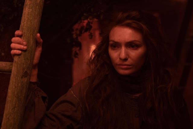 Amy (Eleanor Tomlinson) tries to find a safe place to escape from the 20-foot spiders from Mars