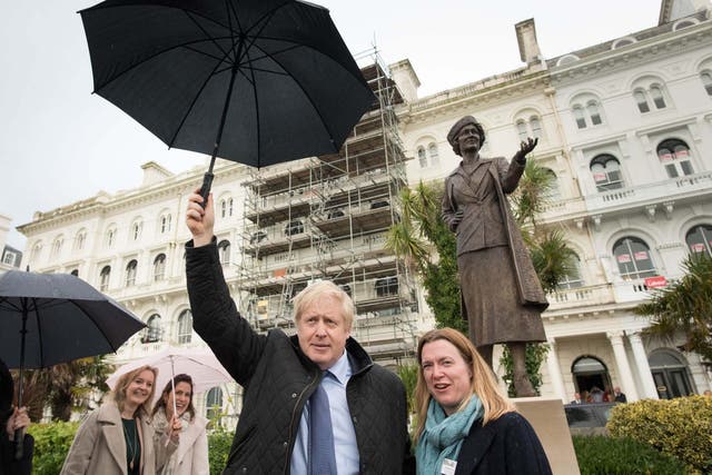 Boris Johnson and Plymouth parliamentary candidate, Rebecca Smith look at a statue of Nancy Astor, the first female MP to sit in parliament