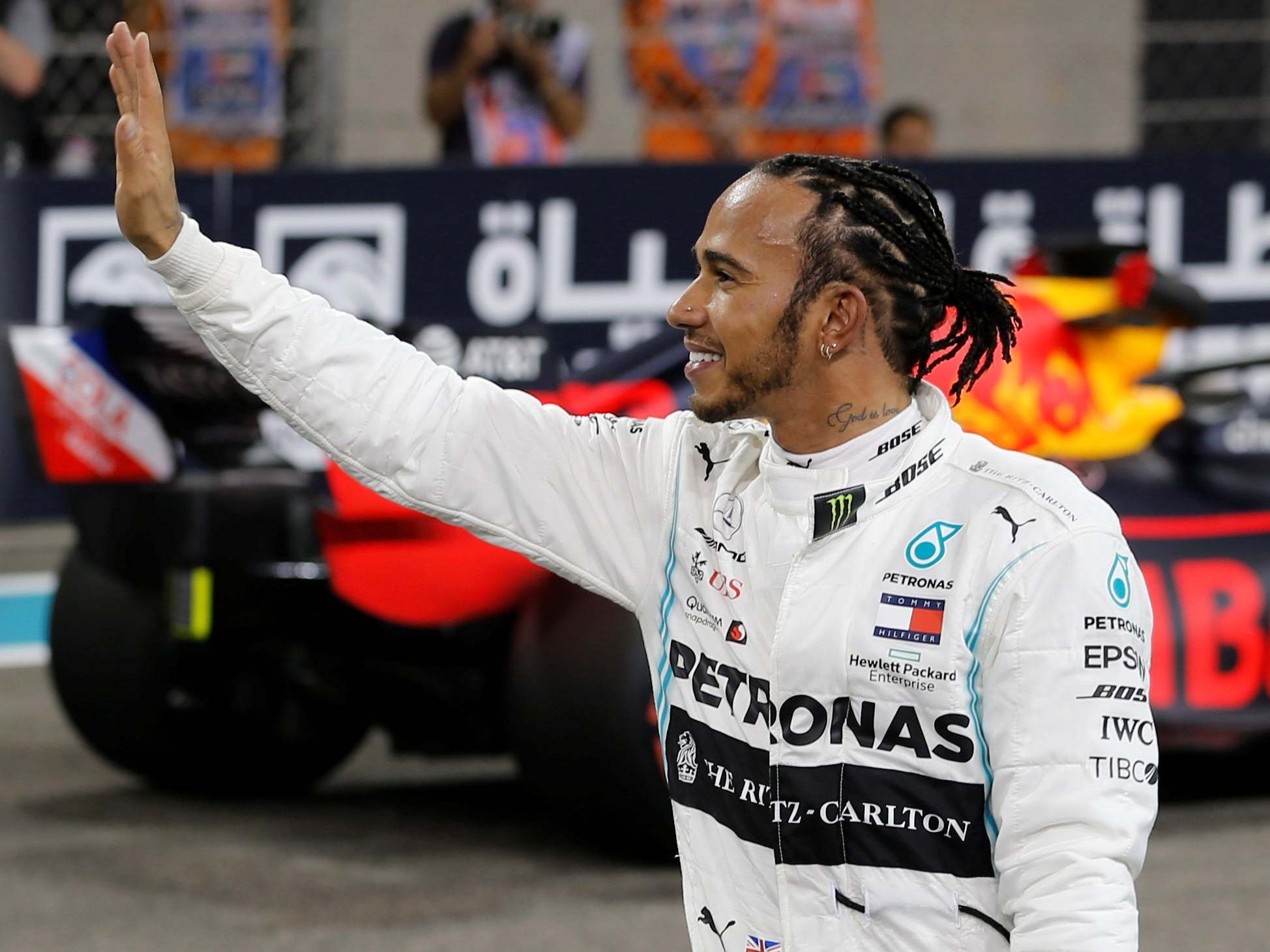 Lewis Hamilton waves to the crowd after sealing pole position