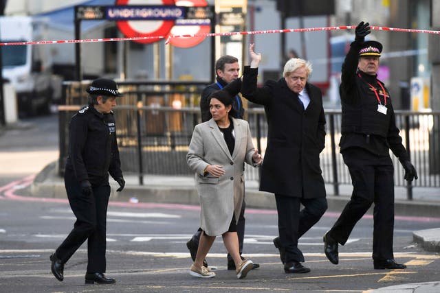Boris Johnson and home secretary Priti Patel visit the scene of the incident on Saturday