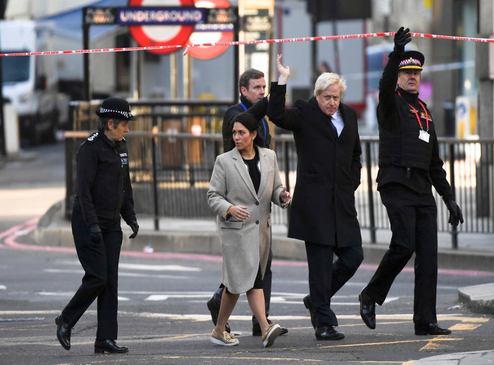 Boris Johnson and home secretary Priti Patel visit the scene of the incident on Saturday
