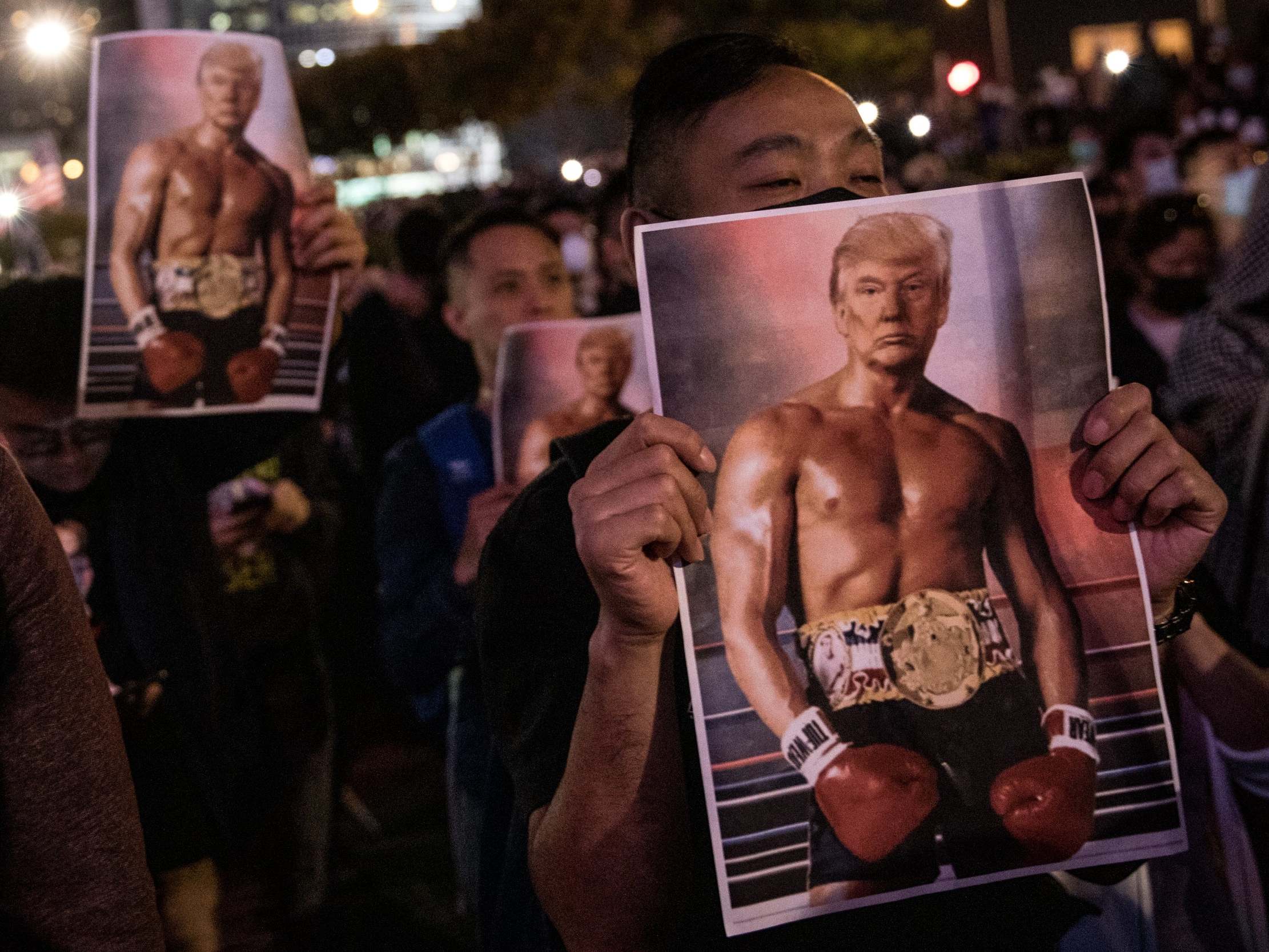 Pro-democracy protesters hold posters of US president Donald Trump during a Thanksgiving Day rally at Edinburgh Place on 28 November, 2019 in Hong Kong, China.