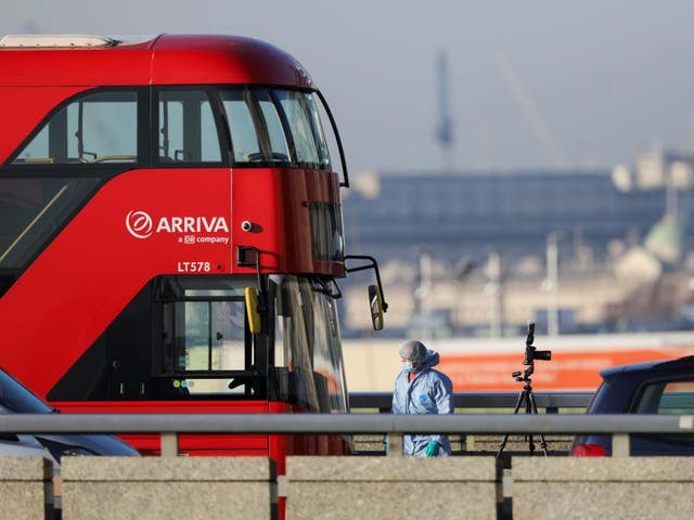 A forensic officer works at the scene of the stabbing on London Bridge