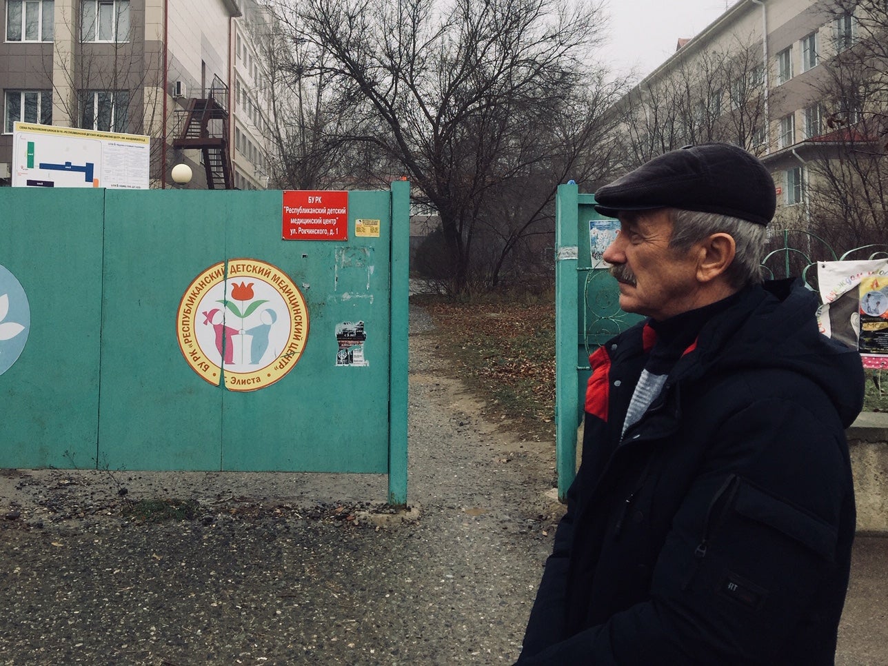 Alexander Gorobchenko stands in front of Elista’s children’s hospital where three decades ago his son Sergei was infected with HIV. Gorobchenko says the reaction of the local community “devastated” him and his family.