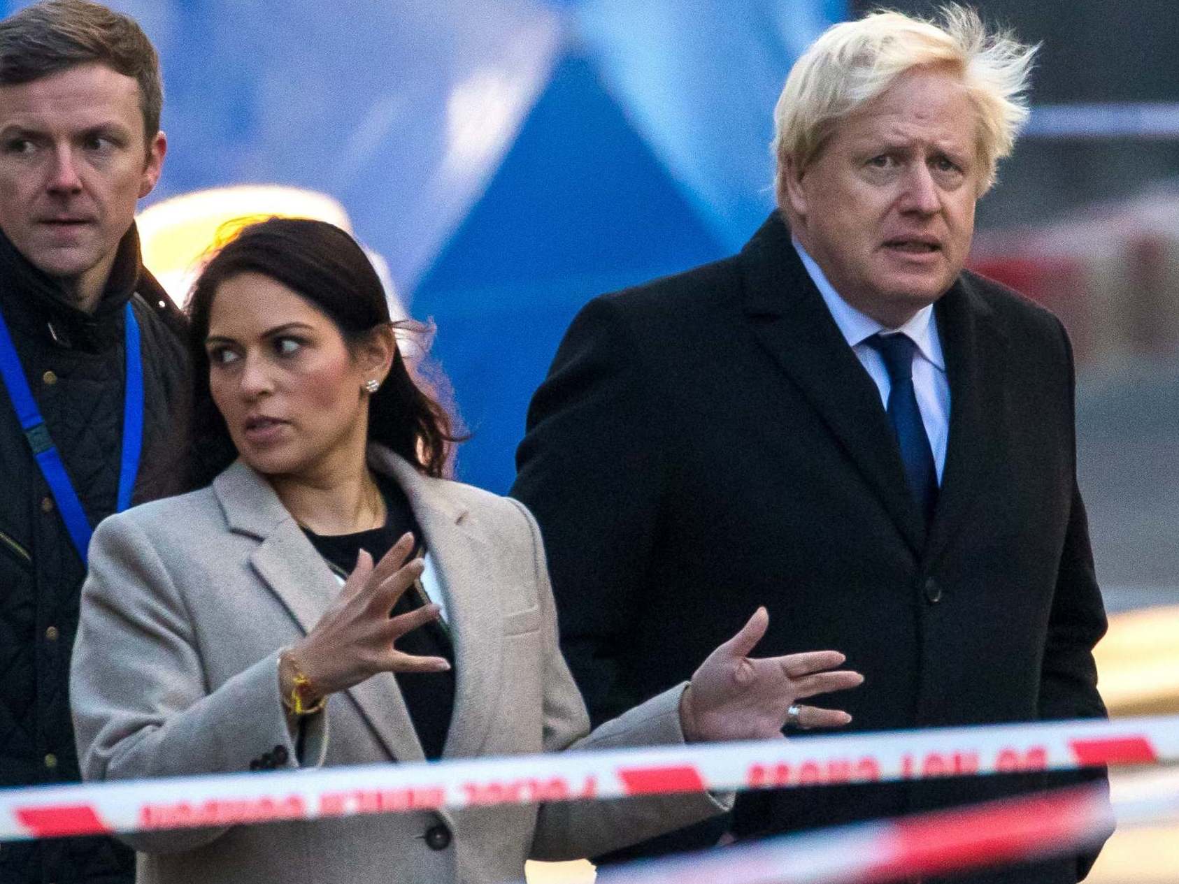 Boris Johnson and Priti Patel visit the scene of the attack