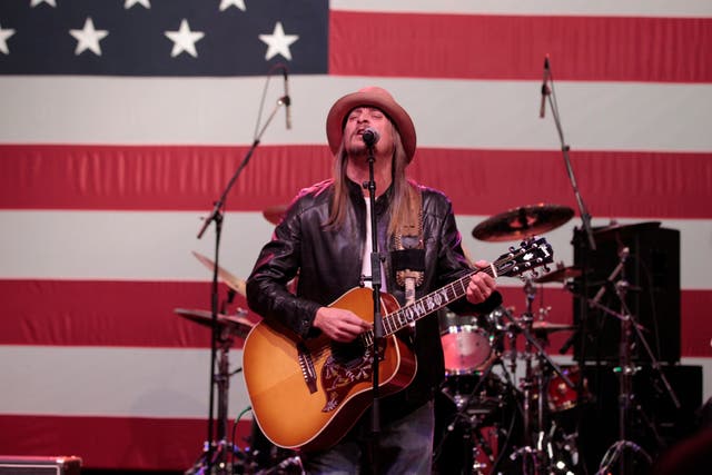 Kid Rock performing at a rally for former Republican presidential candidate Mitt Romney