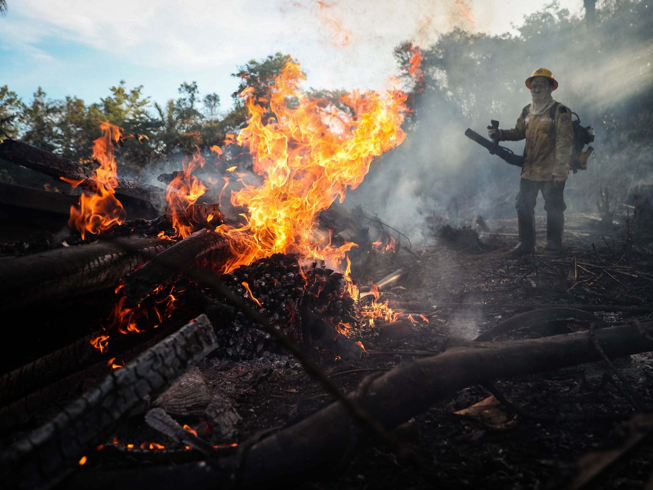 Prevfogo firefighters, an Ibama forest brigade formed by indigenous people of the Tenhari ethnic group, participate in fire fighting efforts in the Brazilian amazon