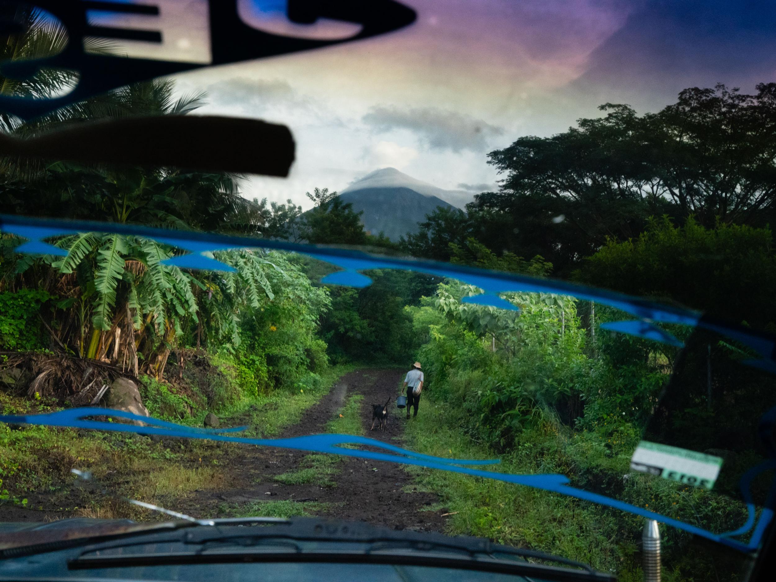 A farmer makes his way on foot up the mountain to his plot of land in Quince de Octubre La Trinidad, Guatemala as volcano (The Washington Post)