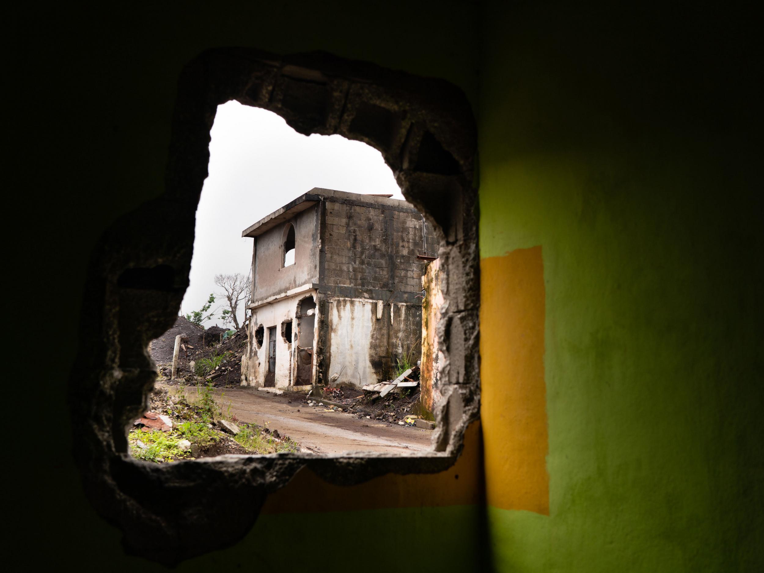 The former village of San Miguel Los Lotes through another building destroyed by a volcano (The Washington Post)