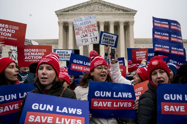 Gun safety activists demonstrate in front of the Supreme Court in Washington DC ahead of oral arguments in the case NY State Rifle and Pistol vs the City of New York