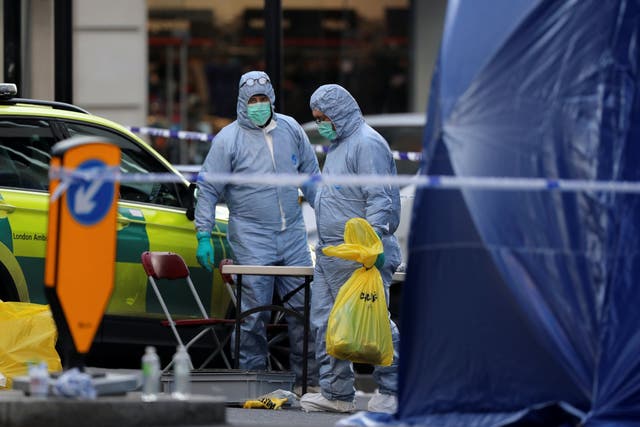 Forensic officers at work at London Bridge following the attack
