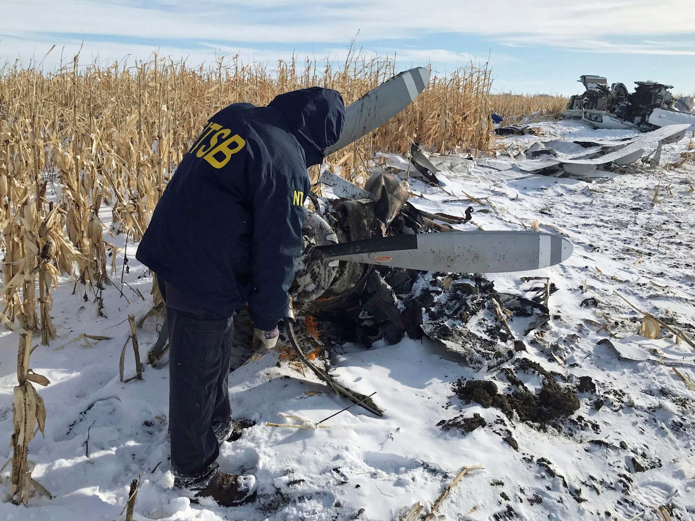 An NTSB air safety investigator begins the initial examination of the wreckage of the Pilatus PC-12 that crashed in Chamberlain, South Dakota