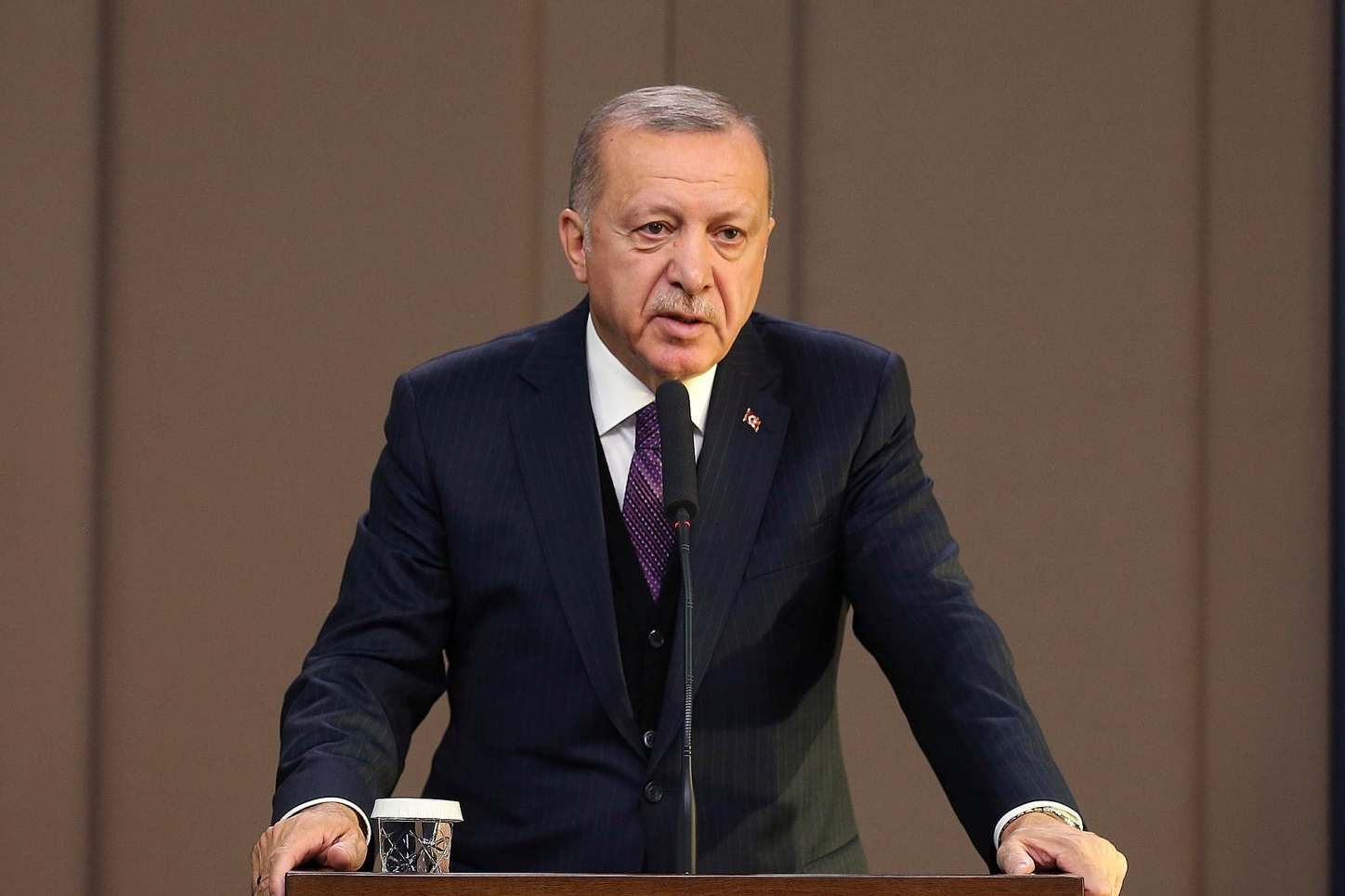 Recep Tayyip Erdogan speaks before departing to attend a Nato leader's summit in London