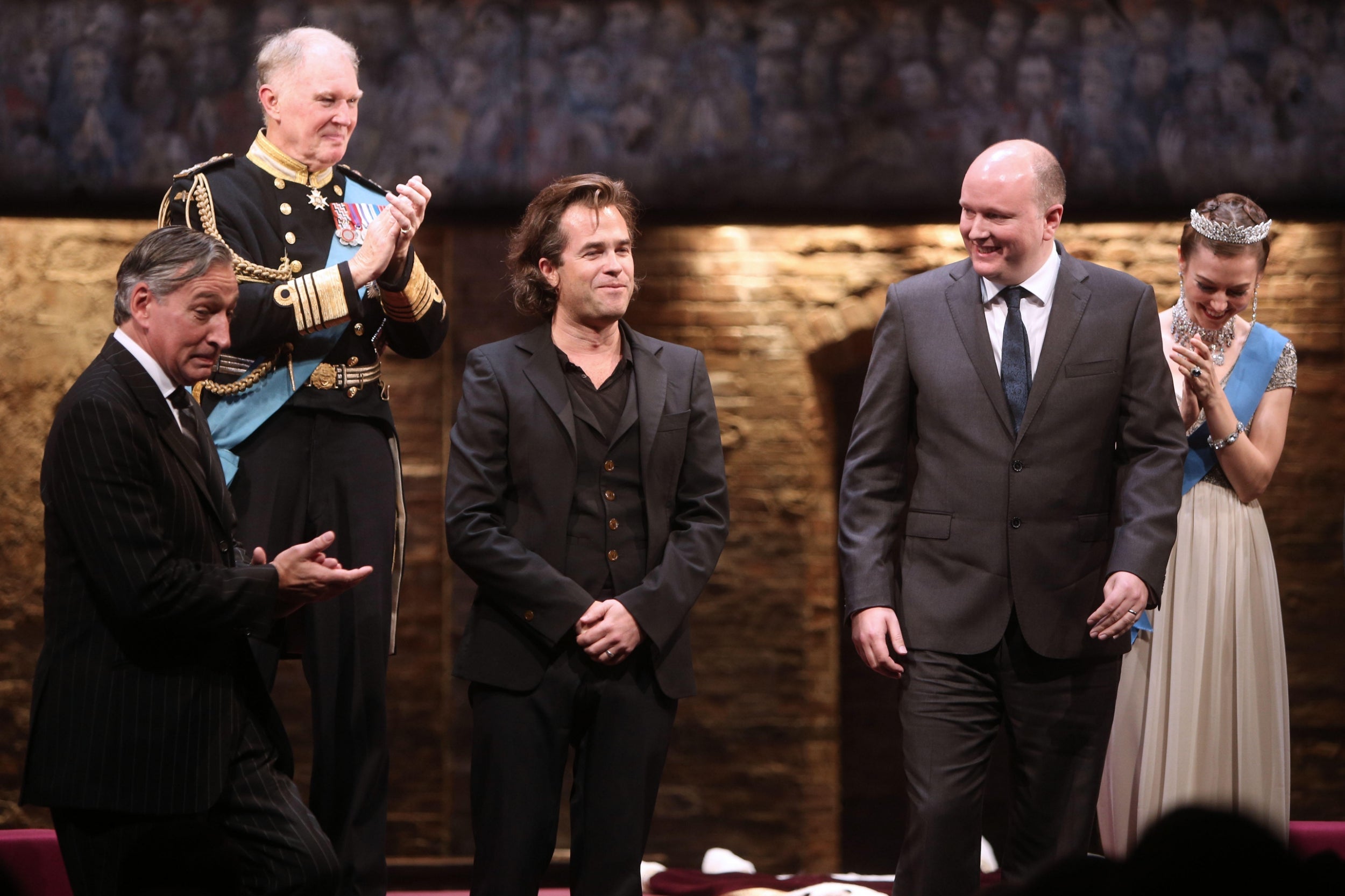 (L-R) Miles Richardson as James Reiss, Tim Pigott-Smith as Prince Charles, director Rupert Goold, playwright Bartlett and Lydia Wilson as Kate Middleton take a bow during the curtain call for the Broadway opening night of ‘King Charles III’ at the Music Box Theatre in New York City in 2015